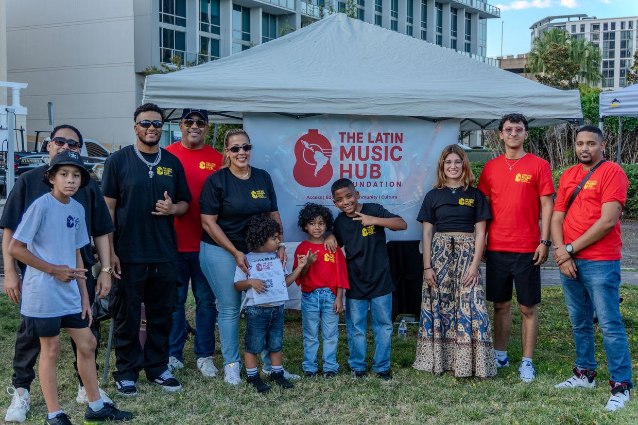 Families, volunteers and young musicians at a Latin Music Hub Foundation community event