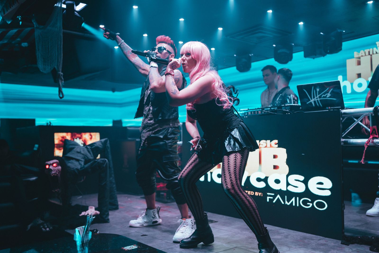 Artists performing on stage at a Latin Music Hub showcase
